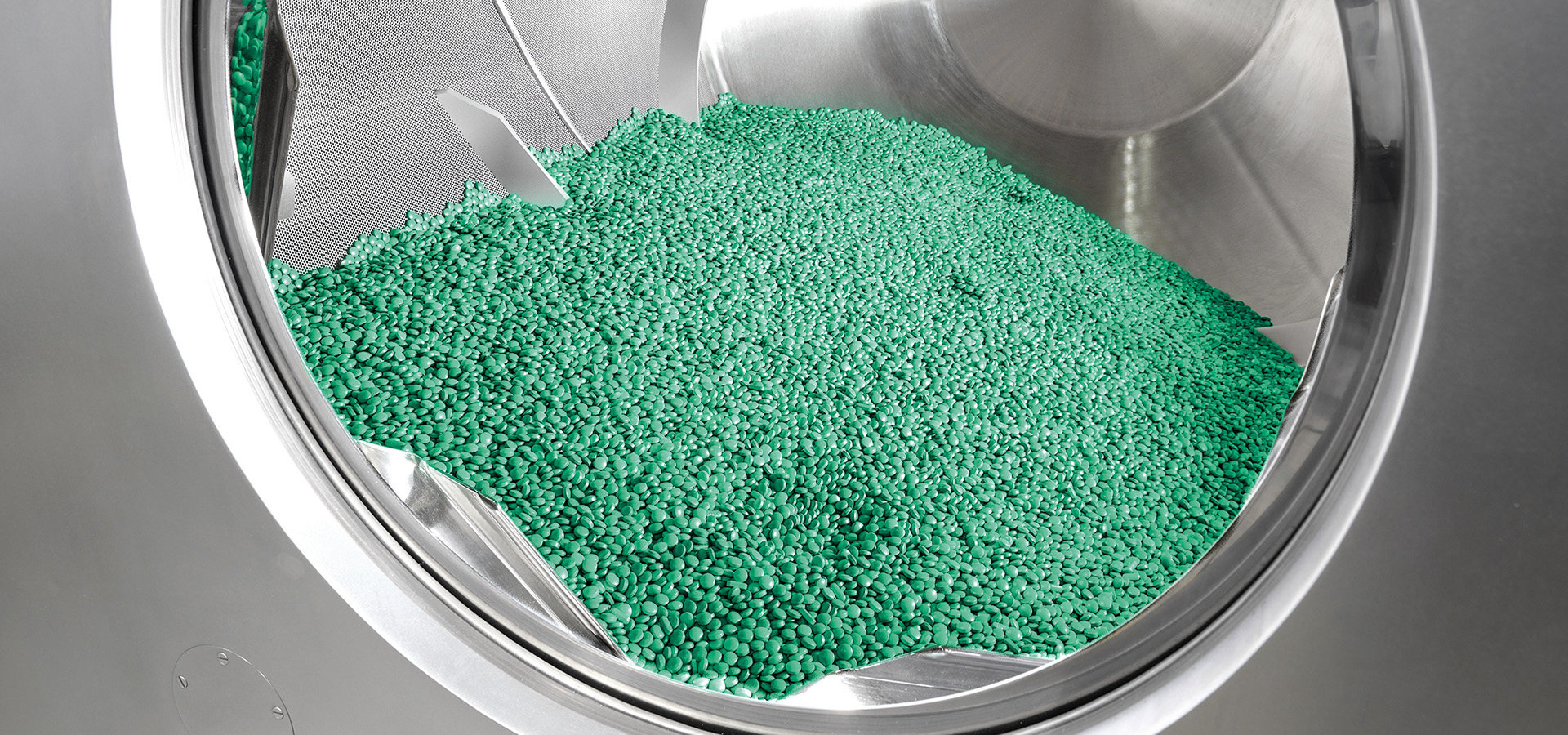 Tablets inside a coating drum, Syntegon photograph
